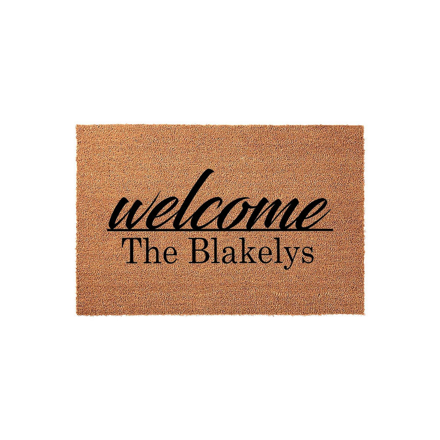 Personalized family name coir doormat featuring a natural tan fiber texture and bold black lettering that says welcome above a custom last name, providing a classic and durable entryway decor piece for any home front porch or