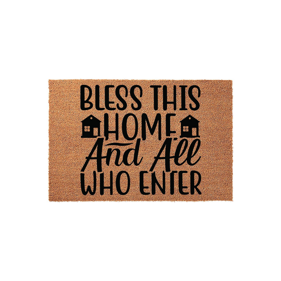 Bless This Home And All Who Enter coir doormat featuring black typography and two small house icons, presented on a clean white background to showcase the natural fiber texture of this welcoming front porch entryway decor piece.