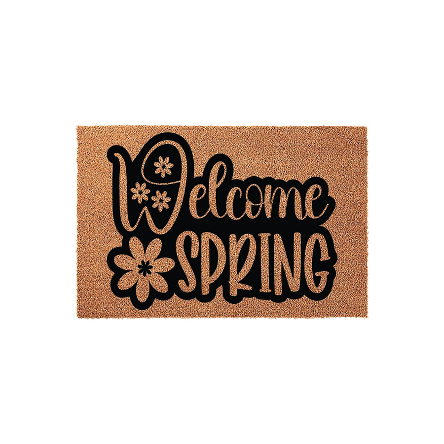 Welcome Spring coir doormat featuring bold black lettering and decorative flower accents on a natural tan fiber background, creating a cheerful seasonal entryway decor piece for your front porch or home entrance.