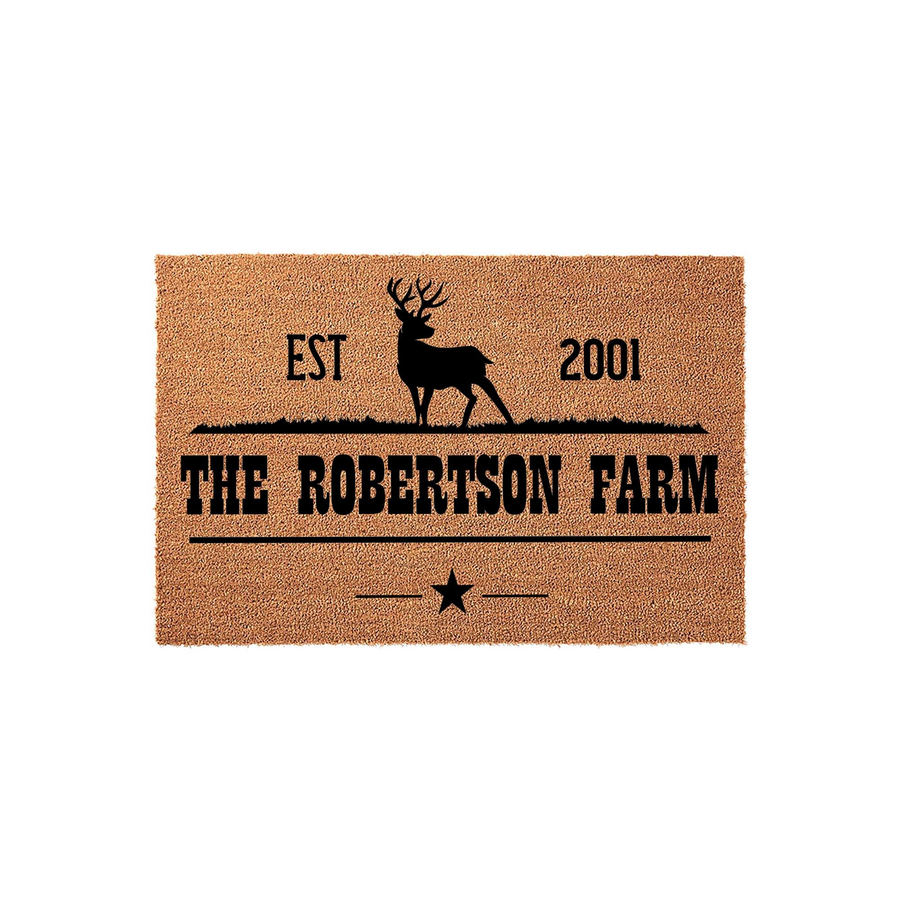 Personalized Deer Farm Doormat featuring a rustic brown coir texture with a black silhouette of a buck, the text EST 2001, and a custom family name printed in a bold, classic font above a decorative star and horizontal line