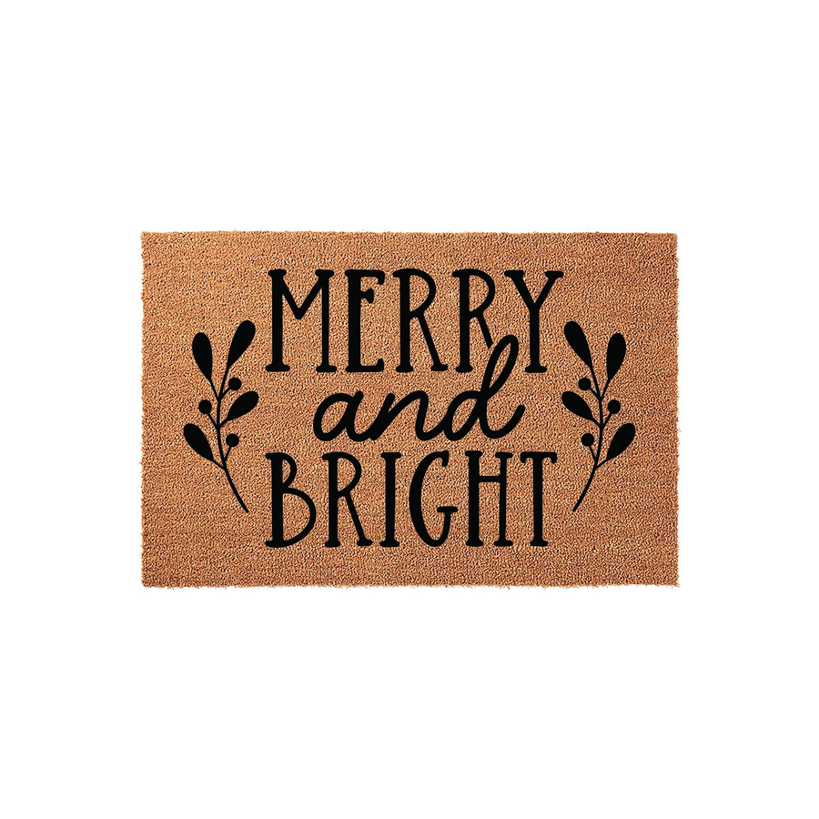 Merry and Bright Christmas coir doormat featuring black text and decorative sprigs on a natural brown fiber background, providing a festive and welcoming holiday entrance for your front porch or home entryway during the winter