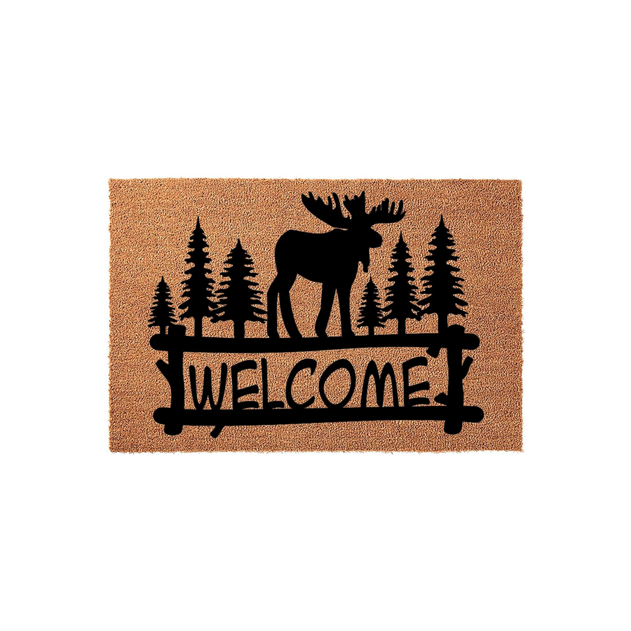 Rustic Moose Welcome Doormat featuring a natural coir texture with a black silhouette of a moose standing in a pine forest, framed by a wooden fence design that displays the word Welcome in a clean, bold, and inviting outdoor