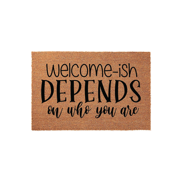 Funny Welcome-ish Depends On Who You Are doormat made of natural coir fiber with black printed text, featuring a humorous message centered on a rectangular mat against a clean white background for a modern home entryway decor
