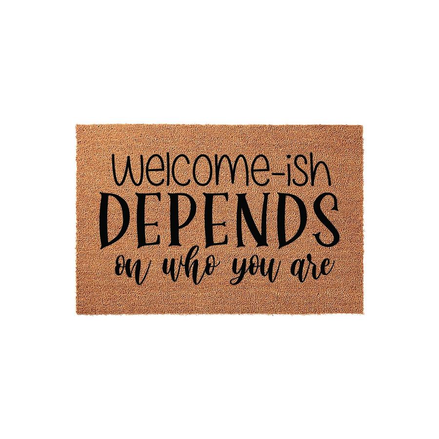 Funny Welcome-ish Depends On Who You Are doormat made of natural coir fiber with black printed text, featuring a humorous message centered on a rectangular mat against a clean white background for a modern home entryway decor