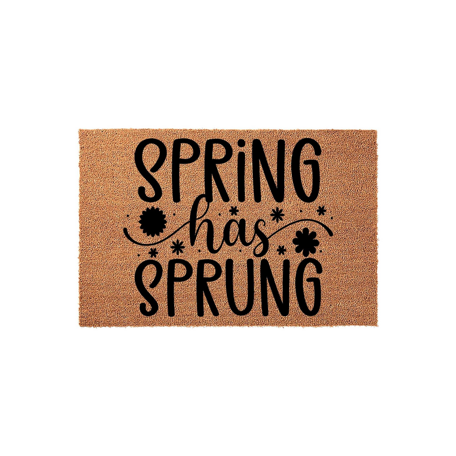 Spring Has Sprung Coir Doormat featuring a natural tan fiber texture with bold black lettering and decorative flower accents, creating a cheerful seasonal welcome for your front porch entryway during the spring season.