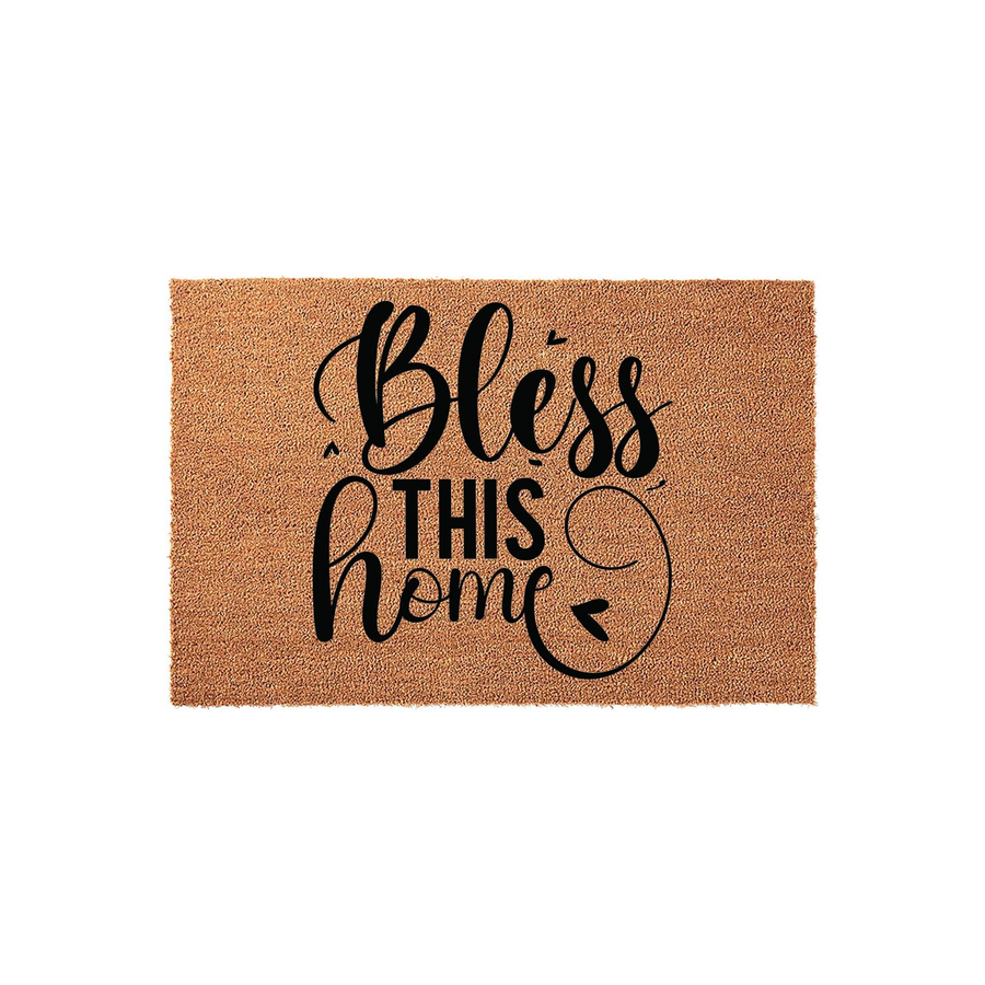 Bless This Home coir doormat featuring a natural brown fiber texture and bold black script lettering, providing a welcoming farmhouse aesthetic for your front porch entrance on a clean white background.