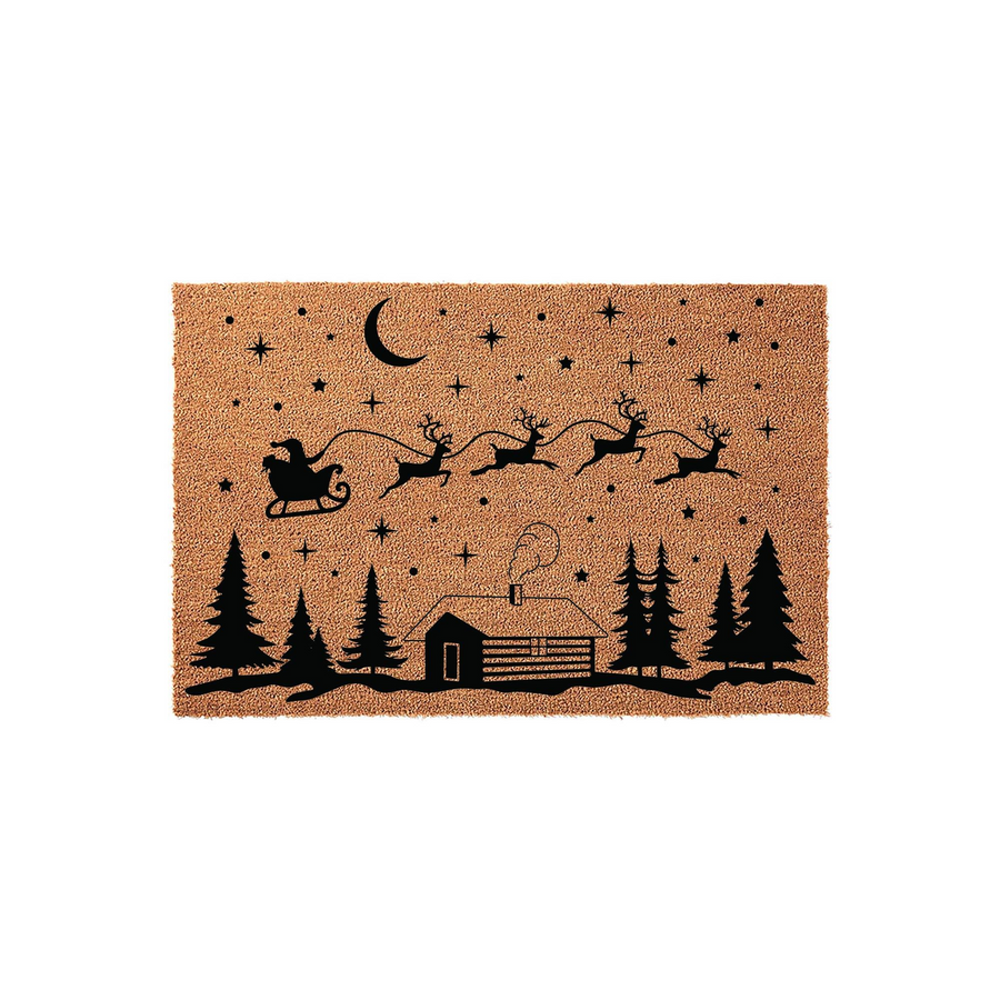 Christmas Santa Sleigh Coir Doormat featuring a black silhouette of Santa and his reindeer flying over a cozy cabin in the woods, set against a starry night sky on a natural tan textured fiber background for festive holiday home