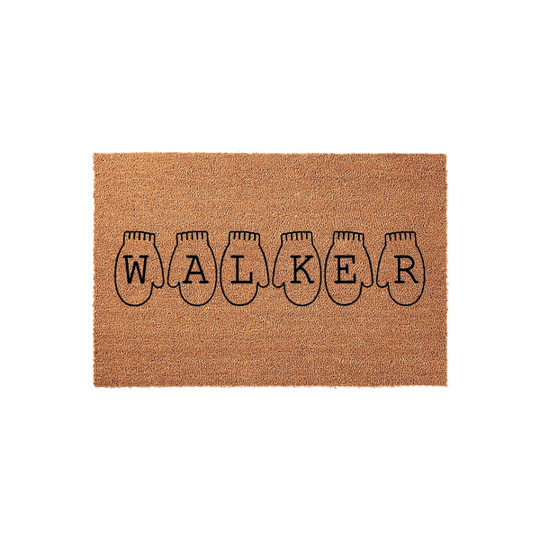 Personalized family name coir doormat featuring a custom last name printed inside a row of six black winter mitten outlines, set against a plain white background to highlight the natural tan texture of the durable outdoor welcome