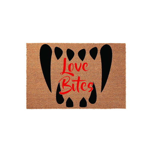 Love Bites Halloween doormat featuring a natural coir texture with a bold black vampire fang design and red script text centered on the mat, creating a spooky and fun entryway decoration for the fall season and holiday home decor.