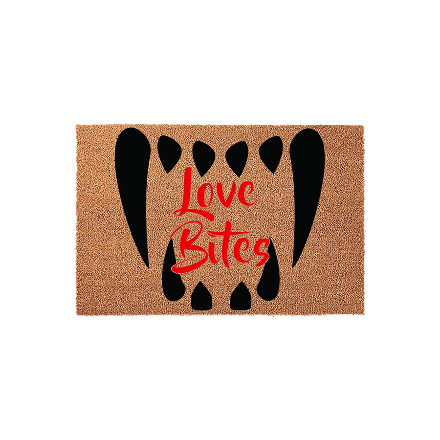 Love Bites Halloween doormat featuring a natural coir texture with a bold black vampire fang design and red script text centered on the mat, creating a spooky and fun entryway decoration for the fall season and holiday home decor.