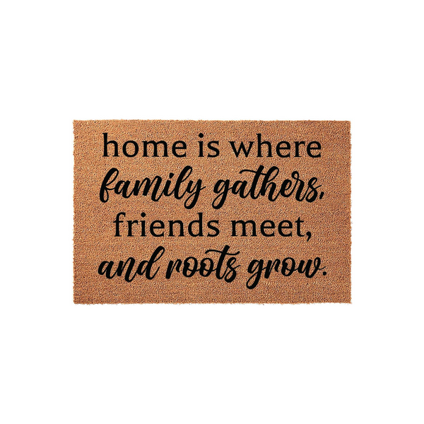 Home Is Where Family Gathers doormat featuring a natural coir texture and black printed text that reads home is where family gathers, friends meet, and roots grow, creating a welcoming entrance for any front porch or entryway.