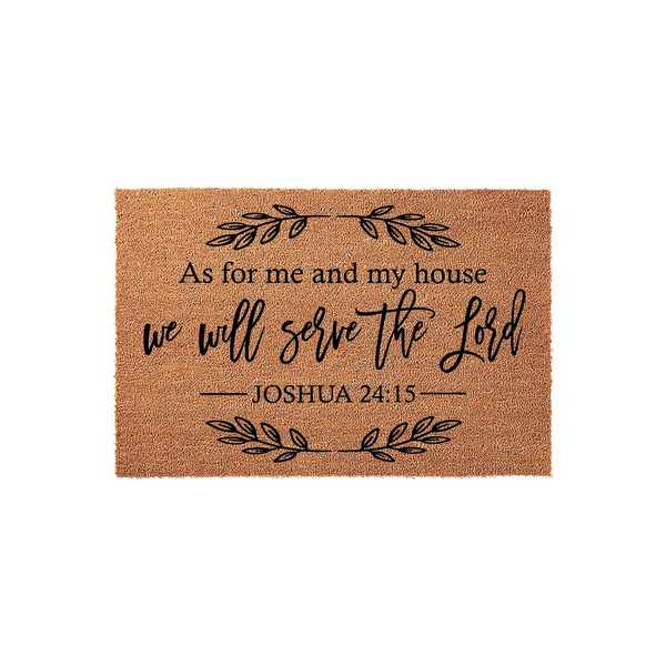 Religious Scripture Coir Doormat featuring the text As for me and my house we will serve the Lord Joshua 24:15 in black script and serif fonts, accented by decorative leaf branches on a natural brown textured coir fiber