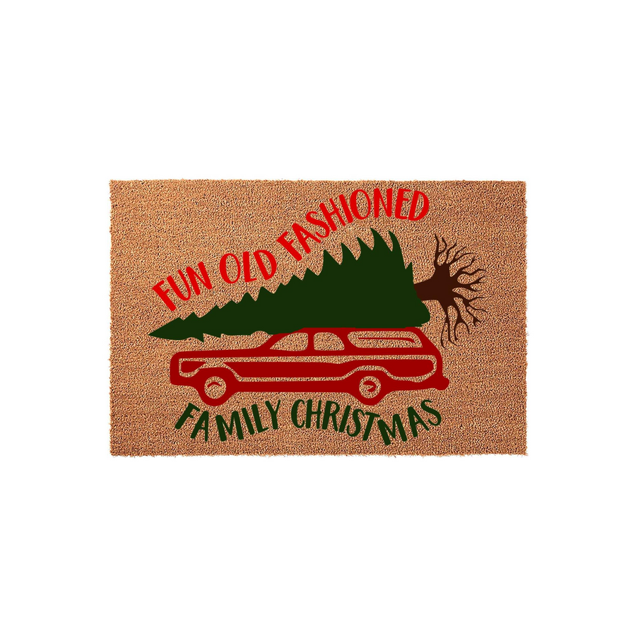 Fun Old Fashioned Family Christmas doormat featuring a red station wagon carrying a large green pine tree on its roof, printed on a natural coir fiber mat with a festive holiday design for your front porch decor during the winter