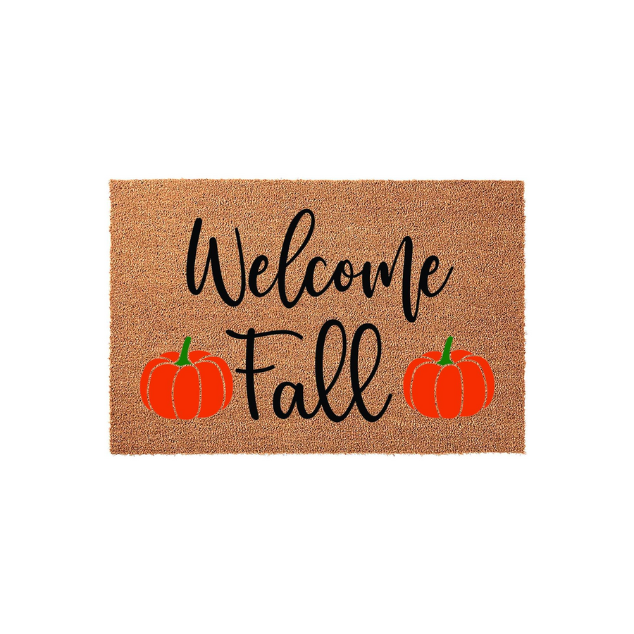 Welcome Fall coir doormat featuring a natural brown fiber texture with black cursive lettering and two bright orange pumpkins, creating a festive seasonal entryway decor piece for your front porch during the autumn months.