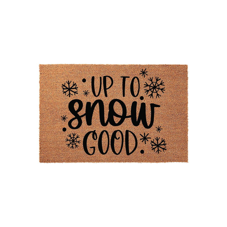 Up To Snow Good Winter Doormat featuring a natural coir texture with black printed text and snowflake accents, creating a festive holiday entryway decor piece that adds a fun seasonal touch to your front porch or home entrance