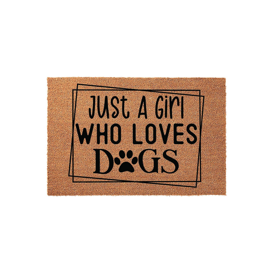 Just A Girl Who Loves Dogs coir doormat featuring a natural tan fiber texture and bold black text with a paw print replacing the letter O, set against a clean white background for a modern and welcoming entryway decor style.
