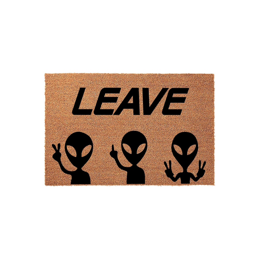 Funny Alien Welcome Doormat featuring the text LEAVE in bold black letters above three alien silhouettes, with the outer two aliens making peace signs and the center alien giving a middle finger on a natural brown coir fiber