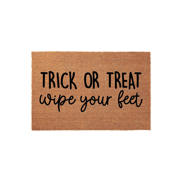 Trick or Treat Wipe Your Feet Halloween Doormat featuring natural coir fibers and bold black lettering, providing a festive and functional way to welcome guests to your front porch during the spooky autumn holiday season.