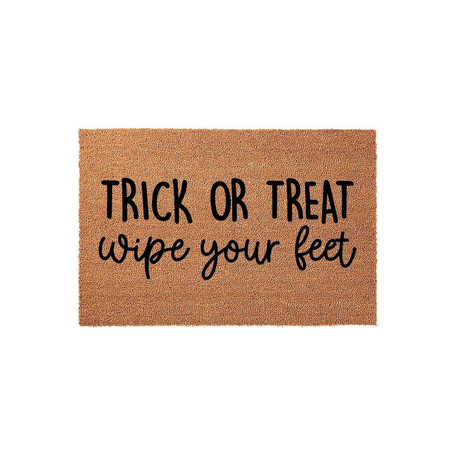 Trick or Treat Wipe Your Feet Halloween Doormat featuring natural coir fibers and bold black lettering, providing a festive and functional way to welcome guests to your front porch during the spooky autumn holiday season.