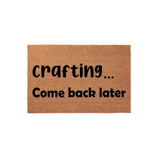 Crafting Come Back Later coir doormat featuring a natural brown fiber texture and bold black lettering, designed as a humorous front porch welcome mat for a creative person who enjoys spending their time working on DIY projects.