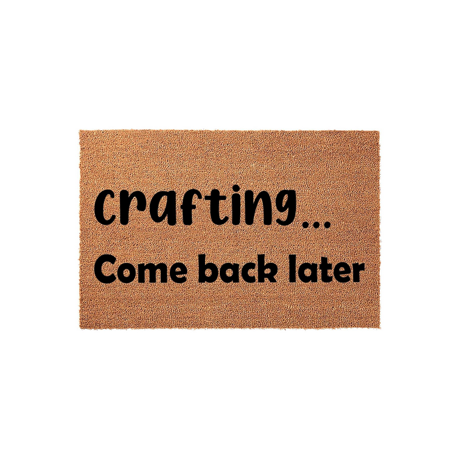 Crafting Come Back Later coir doormat featuring a natural brown fiber texture and bold black lettering, designed as a humorous front porch welcome mat for a creative person who enjoys spending their time working on DIY projects.