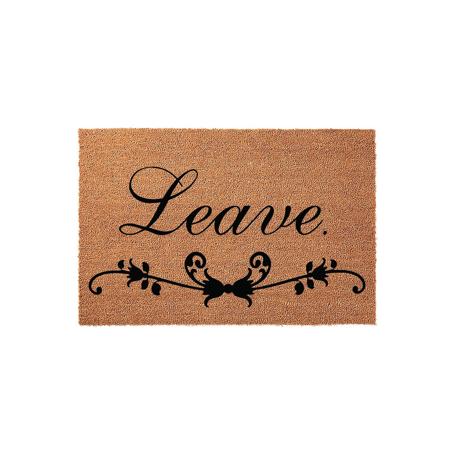 Leave Coir Doormat featuring a natural tan fiber texture with bold black script text and a decorative floral vine flourish underneath, creating a humorous and welcoming front porch entrance for your home decor.
