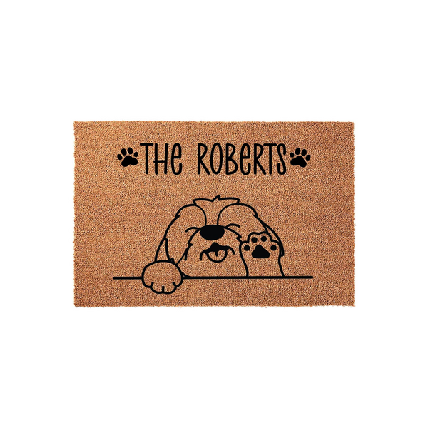 Personalized Shih Tzu Dog Doormat featuring a cute illustrated puppy peeking over a line with paw prints on a natural coir fiber background, customized with a family name to create a welcoming entrance for any dog lover home.