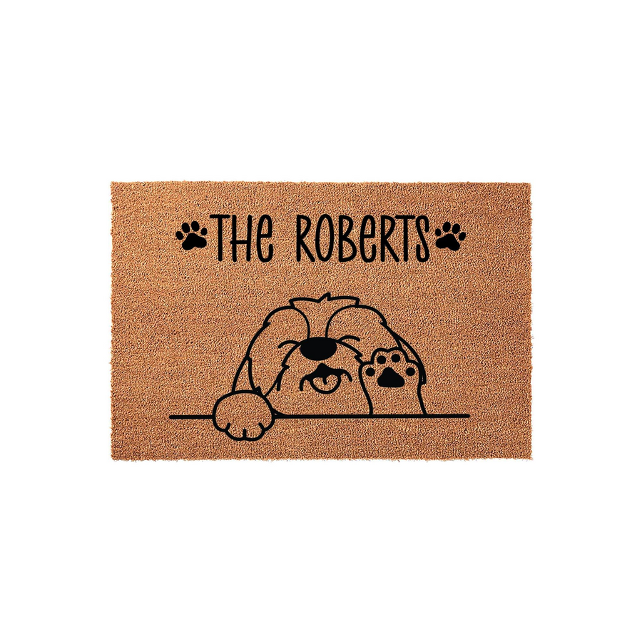 Personalized Shih Tzu Dog Doormat featuring a cute illustrated puppy peeking over a line with paw prints on a natural coir fiber background, customized with a family name to create a welcoming entrance for any dog lover home.