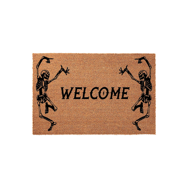 Skeleton Welcome Doormat featuring two dancing black skeletons on a natural tan coir background, with the word Welcome printed in a bold, spooky font to create a festive Halloween entryway decor piece for your front porch or home
