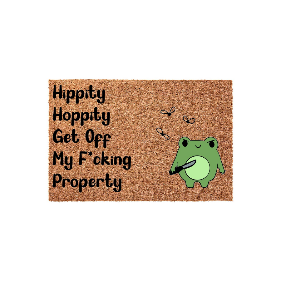Funny Frog Doormat featuring a cute green cartoon frog holding a knife with the text Hippity Hoppity Get Off My Property printed in black on a natural brown coir fiber background, perfect for a humorous front porch entryway decor.