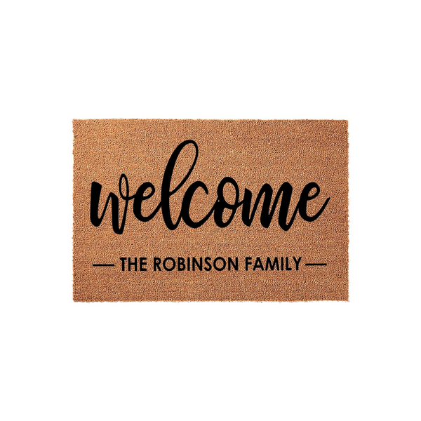 Personalized Coir Welcome Doormat featuring a natural tan fiber texture with the word welcome in a black script font and a customizable family name printed below, creating a classic entryway decor piece for any home front porch.