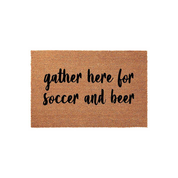 Soccer and beer themed coir doormat featuring the text gather here for soccer and beer in a bold black script font, set against a natural brown textured fiber background for a fun and inviting front porch entrance decor piece.