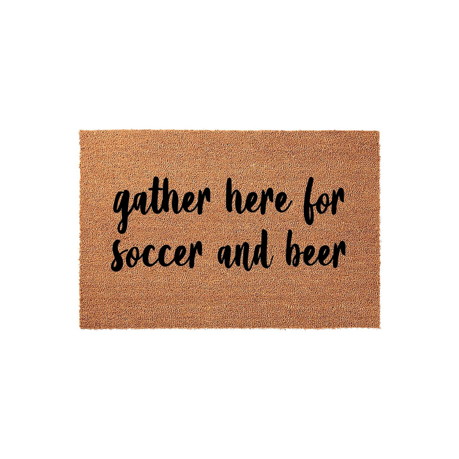 Soccer and beer themed coir doormat featuring the text gather here for soccer and beer in a bold black script font, set against a natural brown textured fiber background for a fun and inviting front porch entrance decor piece.
