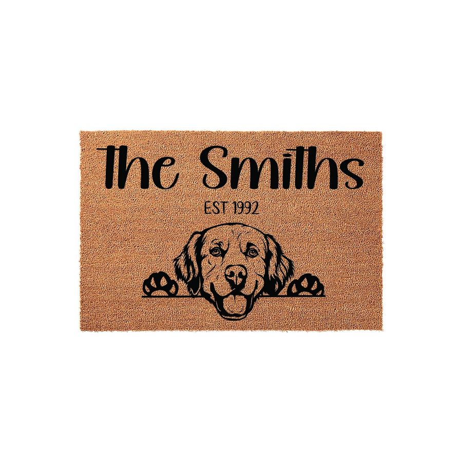 Personalized Golden Retriever family doormat featuring a natural coir texture with a black printed illustration of a dog peeking over the edge, customized with a family name and established year for a welcoming home entrance