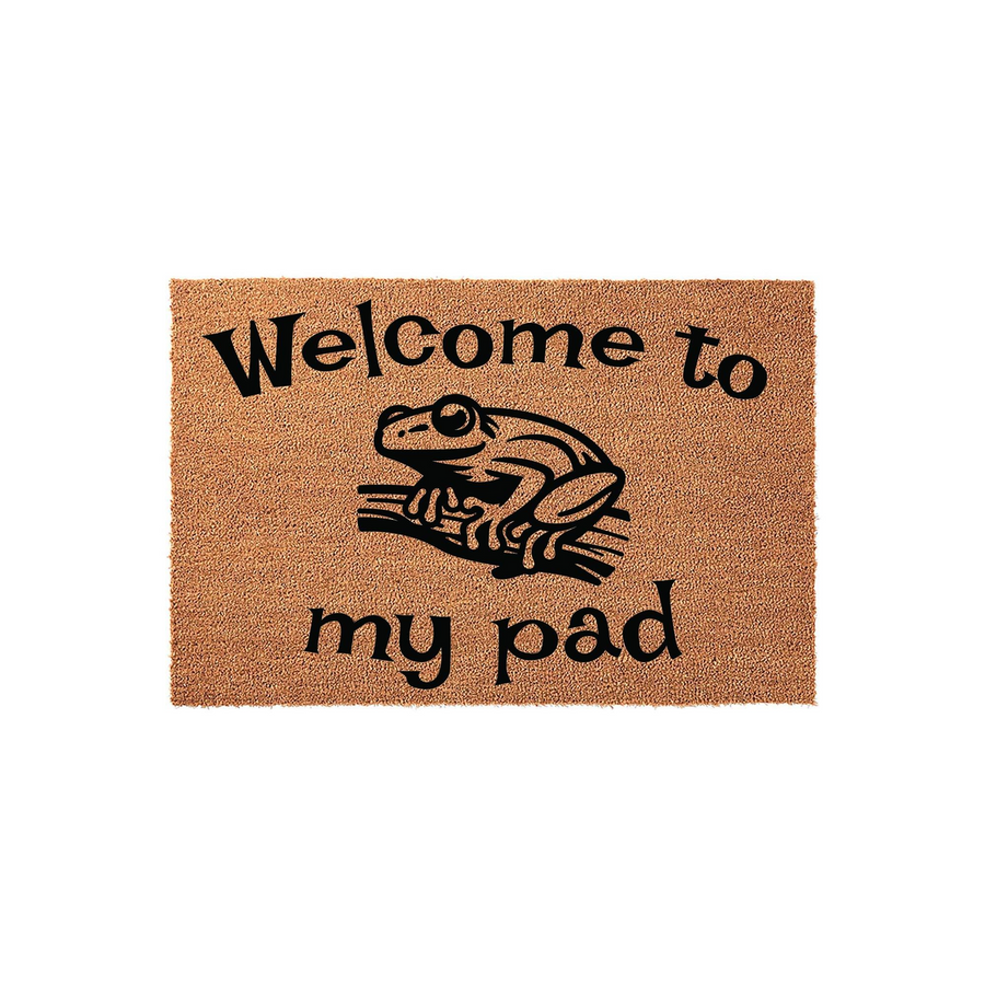 Frog Welcome to My Pad Doormat featuring a natural coir texture with a black printed illustration of a frog sitting on a branch, creating a humorous and welcoming entrance decor piece for any home or apartment front porch