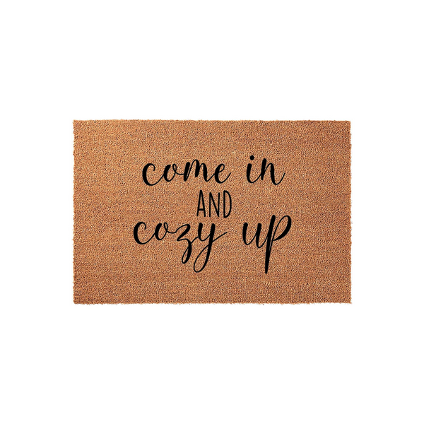 Cozy Up Welcome Doormat featuring a natural coir fiber texture with the phrase come in and cozy up printed in a mix of elegant script and clean sans-serif black lettering, perfect for a warm and inviting front porch entryway