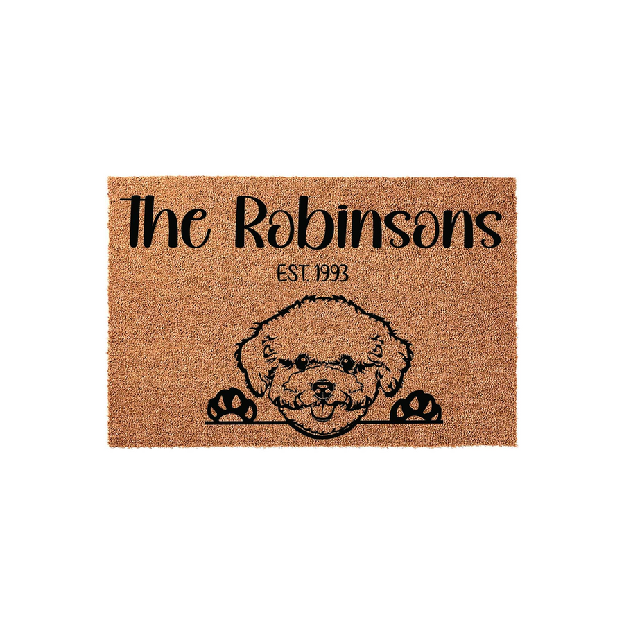 Personalized Poodle Coir Doormat featuring a cute illustrated dog peeking over the bottom edge, customized with a family name and established year printed in bold black text against the natural tan textured fiber background.