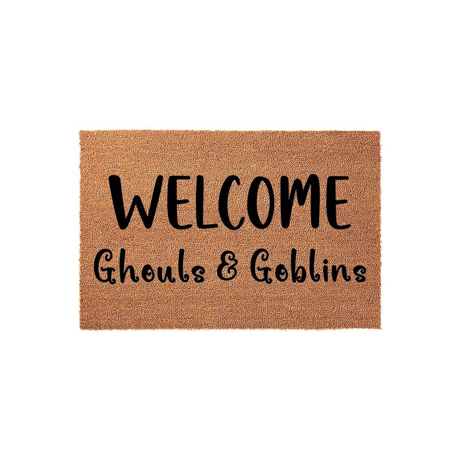 Halloween Welcome Ghouls and Goblins doormat made of natural coir fiber, featuring bold black text printed on a textured brown background to create a festive and spooky entryway decoration for the fall season and trick or