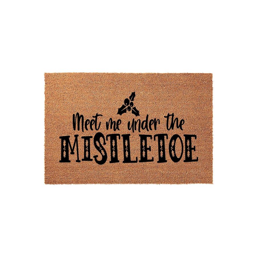 Meet Me Under The Mistletoe Christmas Doormat featuring a natural coir texture with black printed text and a festive mistletoe icon, creating a welcoming holiday entryway decor piece for your front porch during the winter season.