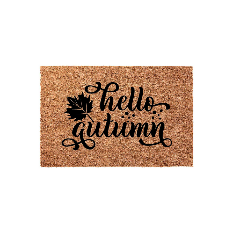 Hello Autumn coir doormat featuring a natural brown fiber texture and bold black script lettering, accented by a detailed maple leaf design that adds a festive seasonal touch to your front porch entryway decor.