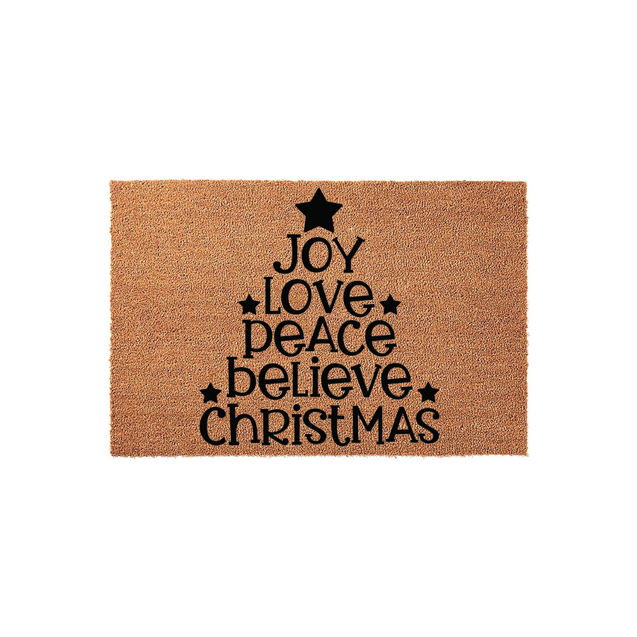 Christmas Tree Holiday Doormat featuring a natural coir texture with black printed text that reads Joy, Love, Peace, Believe, and Christmas arranged in a festive tree shape with star accents on a plain white studio background.