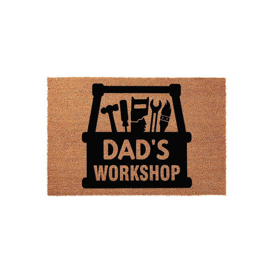 Dad's Workshop coir doormat featuring a black graphic of a toolbox filled with various hand tools, set against a natural brown textured fiber background to create a rustic and functional entryway decor piece for a home garage or