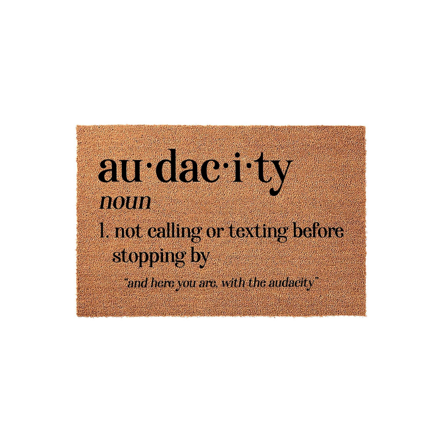 Funny Audacity Definition Doormat featuring a natural coir texture with bold black text that defines audacity as not calling or texting before stopping by, making it a humorous and welcoming addition to any front porch or