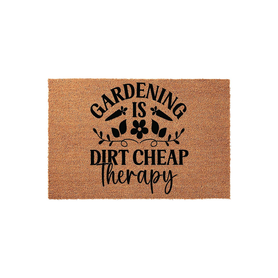 Gardening Is Dirt Cheap Therapy coir doormat featuring a natural brown fiber texture with black printed text and decorative carrot and floral illustrations, perfect for a gardener's front porch or entryway decor on a plain white