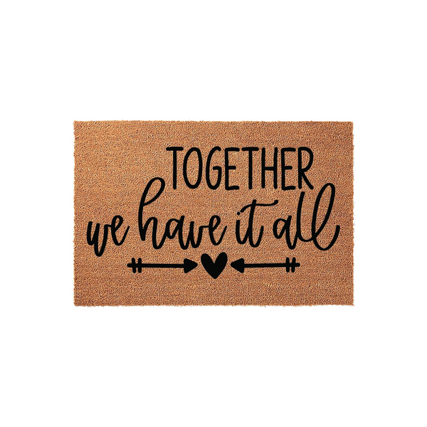 Together We Have It All coir doormat featuring a natural brown fiber texture with black printed text and a decorative arrow and heart design, centered on a clean white background for a modern farmhouse entryway decor aesthetic.
