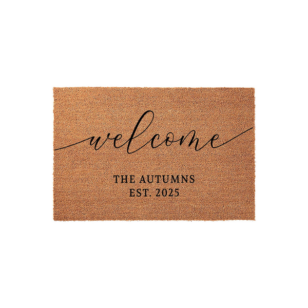 Personalized Coir Welcome Doormat featuring a natural tan fiber texture with black script text that says welcome above a family name and established year, creating a classic and inviting entryway decor piece for any new home.