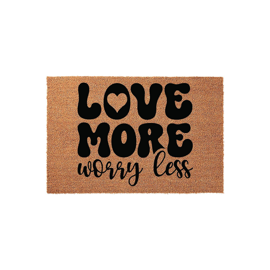 Love More Worry Less coir doormat featuring bold, retro-style black typography on a natural brown coconut fiber background, creating a welcoming and inspirational entryway decor piece for your front porch or home entrance.