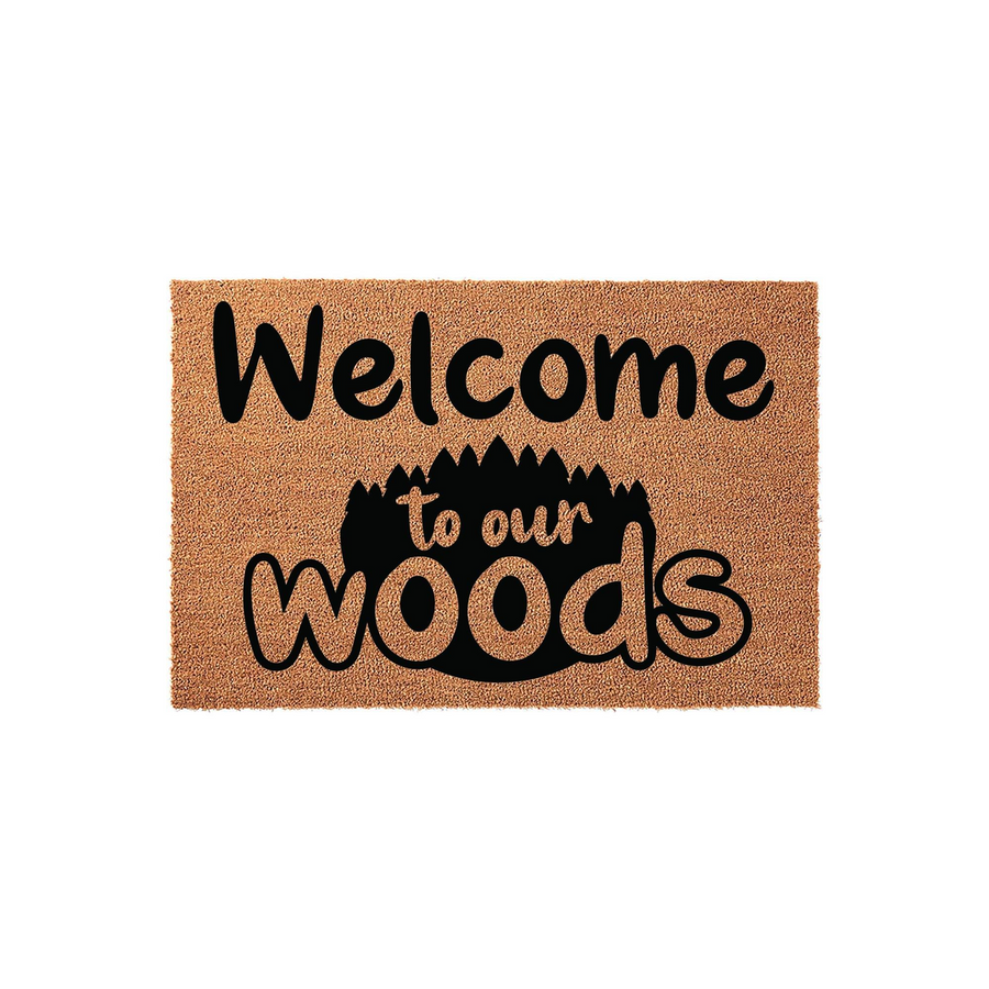Welcome to our woods coir doormat featuring a rustic forest silhouette design in black ink on a natural tan fiber background, creating a charming outdoor entrance decor piece for your cabin, lodge, or woodland themed home