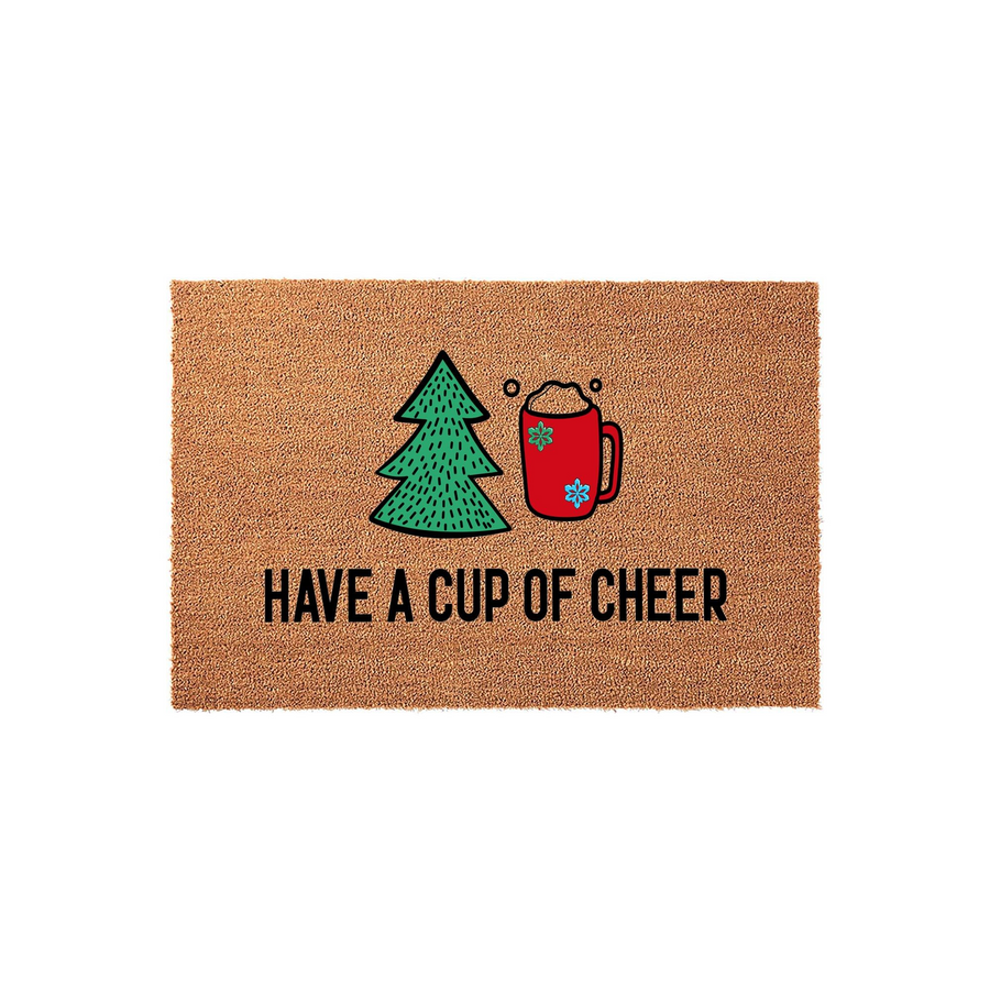 Have a Cup of Cheer Christmas doormat made of natural coir fiber, featuring a festive graphic of a green pine tree and a red mug of hot cocoa with snowflake accents, set against a clean white background for holiday home decor.