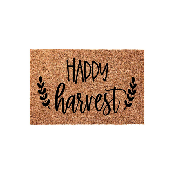 Happy Harvest coir doormat featuring black script lettering and decorative leaf sprigs on a natural brown fiber background, providing a festive seasonal welcome for your front porch entryway during the autumn months.